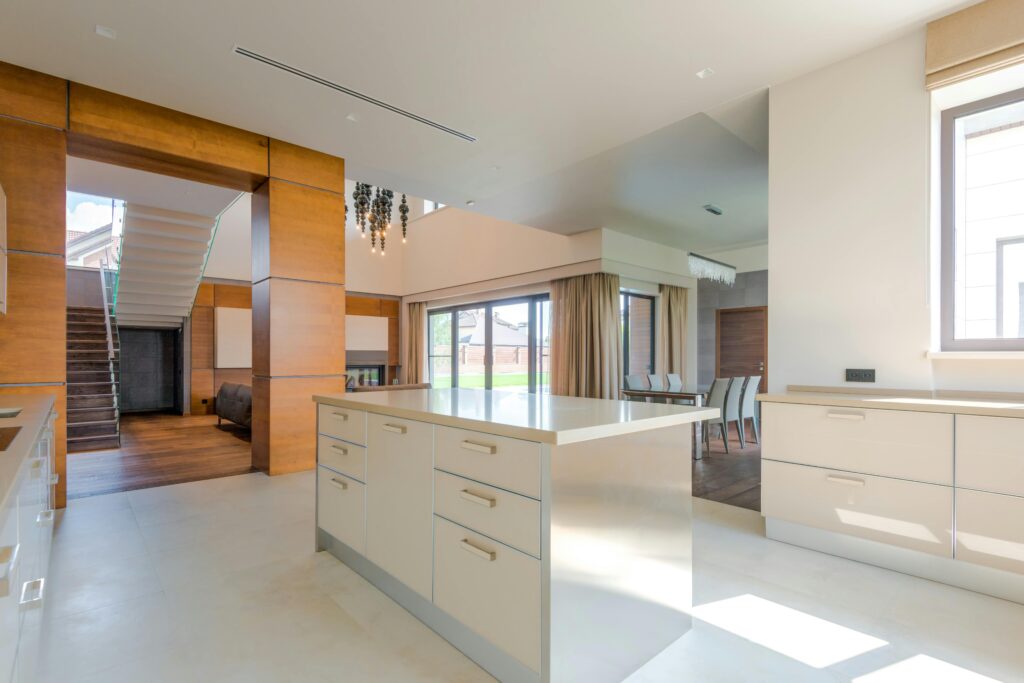Spacious modern kitchen interior blending minimalist design and natural light.